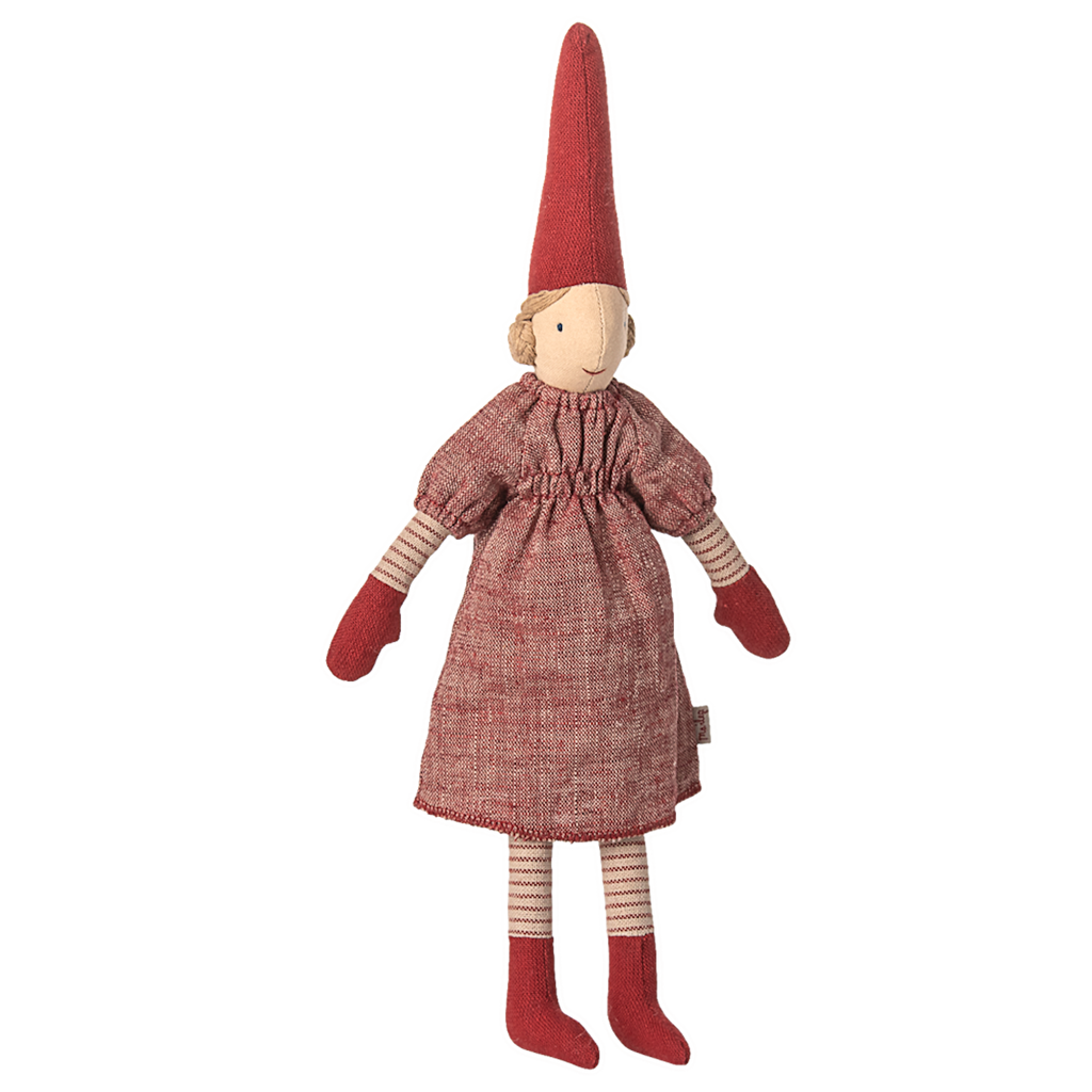 A whimsical cloth doll with a tall red hat, red dress, matching mittens, and striped stockings. It has a simple stitched face, evoking warmth and nostalgia.