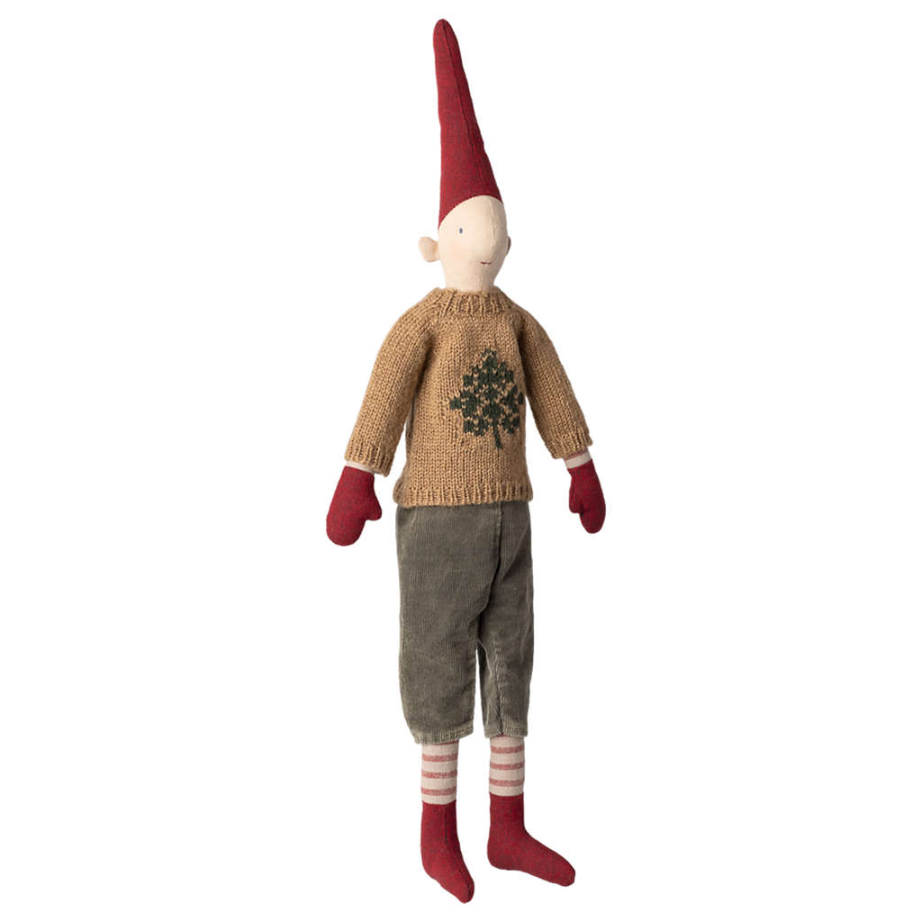 Toy elf with a tall red hat, beige sweater with a tree design, gray pants, red mittens and socks on a white background. Whimsical and festive.