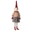 Whimsical doll with a tall red hat, beige sweater with red details, gray skirt, red mittens, and striped leggings, set against a white background.