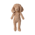A plush, light brown teddy bear with floppy ears, a small stitched nose, and wearing a soft brown scarf. It appears cozy and inviting.