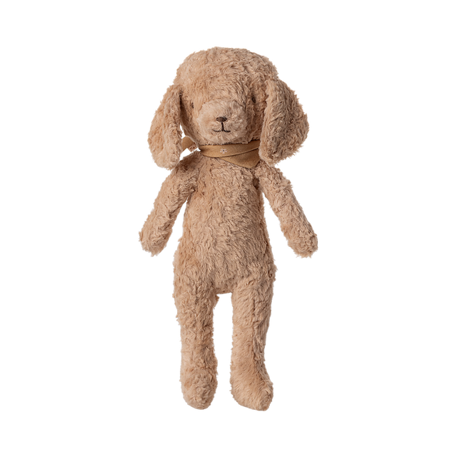 A plush, light brown teddy bear with floppy ears, a small stitched nose, and wearing a soft brown scarf. It appears cozy and inviting.