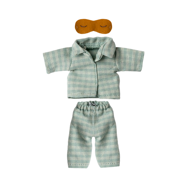 Light blue and white striped doll-sized pajamas with short-sleeved top and pants, accompanied by a small brown sleep mask. The tone is cozy and playful.