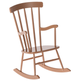 Tan wooden rocking chair for doll with a high back and curved rockers, set against a white background. The chair evokes a sense of nostalgia and comfort.