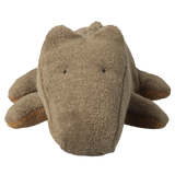Brown plush toy crocodile with a textured fabric, viewed from the front. It has small black eyes and a cute, minimalist design. The background is white.