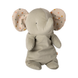 A plush elephant toy with soft gray fabric, floppy ears featuring colorful polka dots, and small black eyes. It exudes a cozy, whimsical charm.