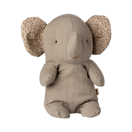 A soft, beige elephant plush toy with patterned fabric inside its large ears. It has a simple, cute expression, conveying warmth and comfort.