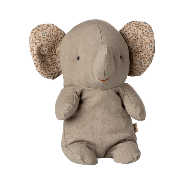 A soft, beige elephant plush toy with patterned fabric inside its large ears. It has a simple, cute expression, conveying warmth and comfort.