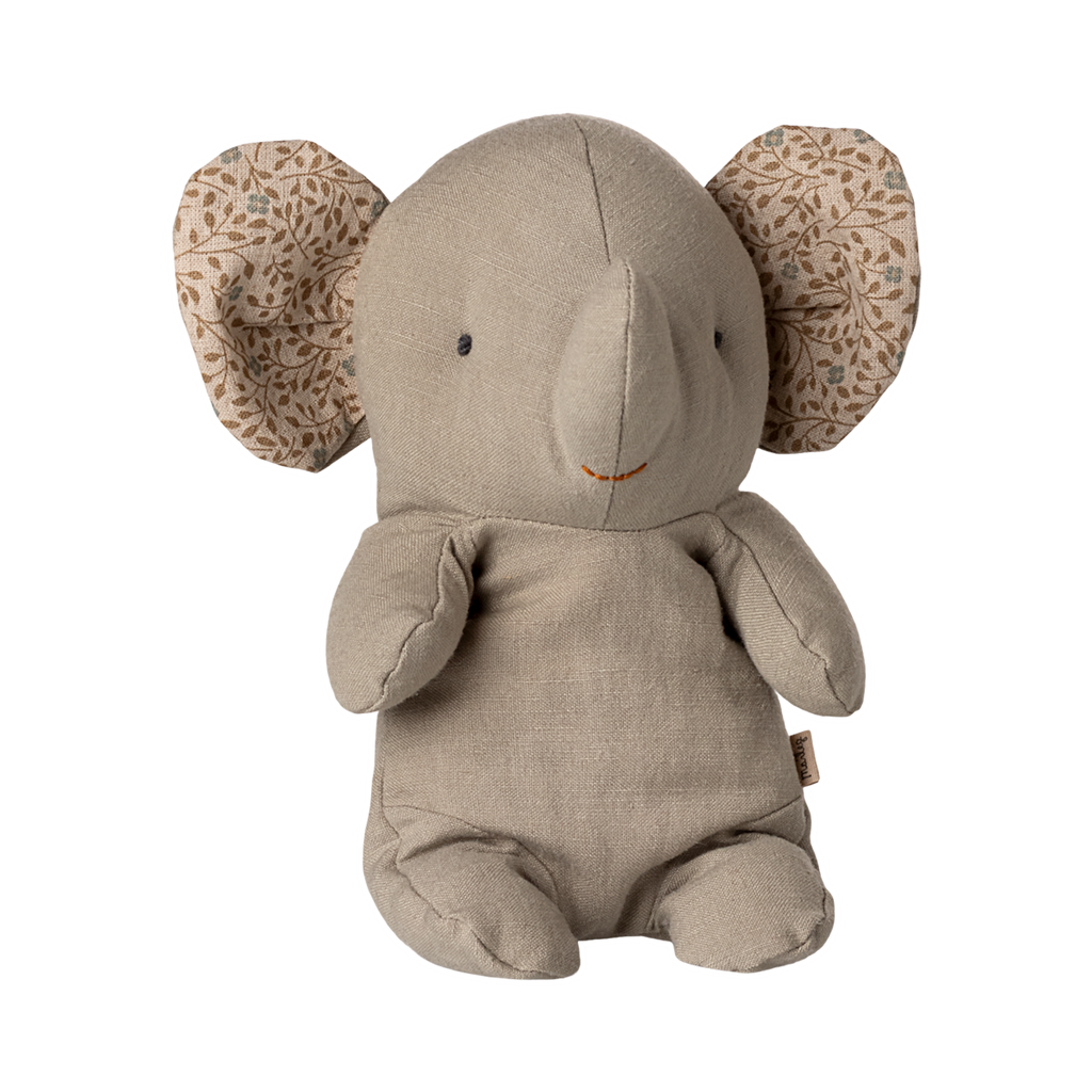 A soft, beige elephant plush toy with patterned fabric inside its large ears. It has a simple, cute expression, conveying warmth and comfort.
