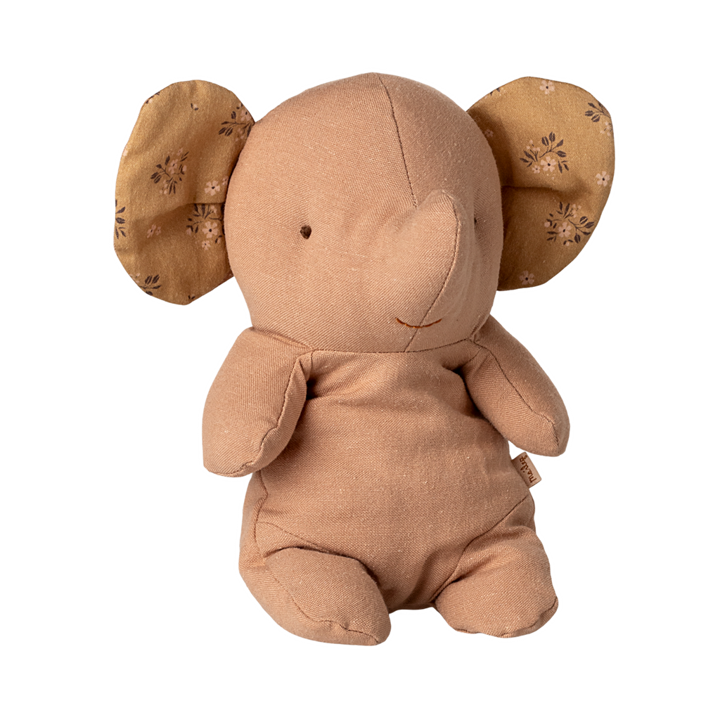 A soft, tan elephant stuffed toy with patterned, floppy ears. Its simple, smiling face and plush body create a warm and comforting appearance.