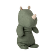 Stuffed toy rhino with a soft, green fabric body, beige horn, and floral-patterned ears. The plush exudes a calm and cozy vibe.