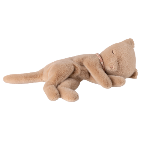 A plush, light brown toy cat lies peacefully on its side against a white background. Its eyes are closed, conveying a sense of calm and relaxation.