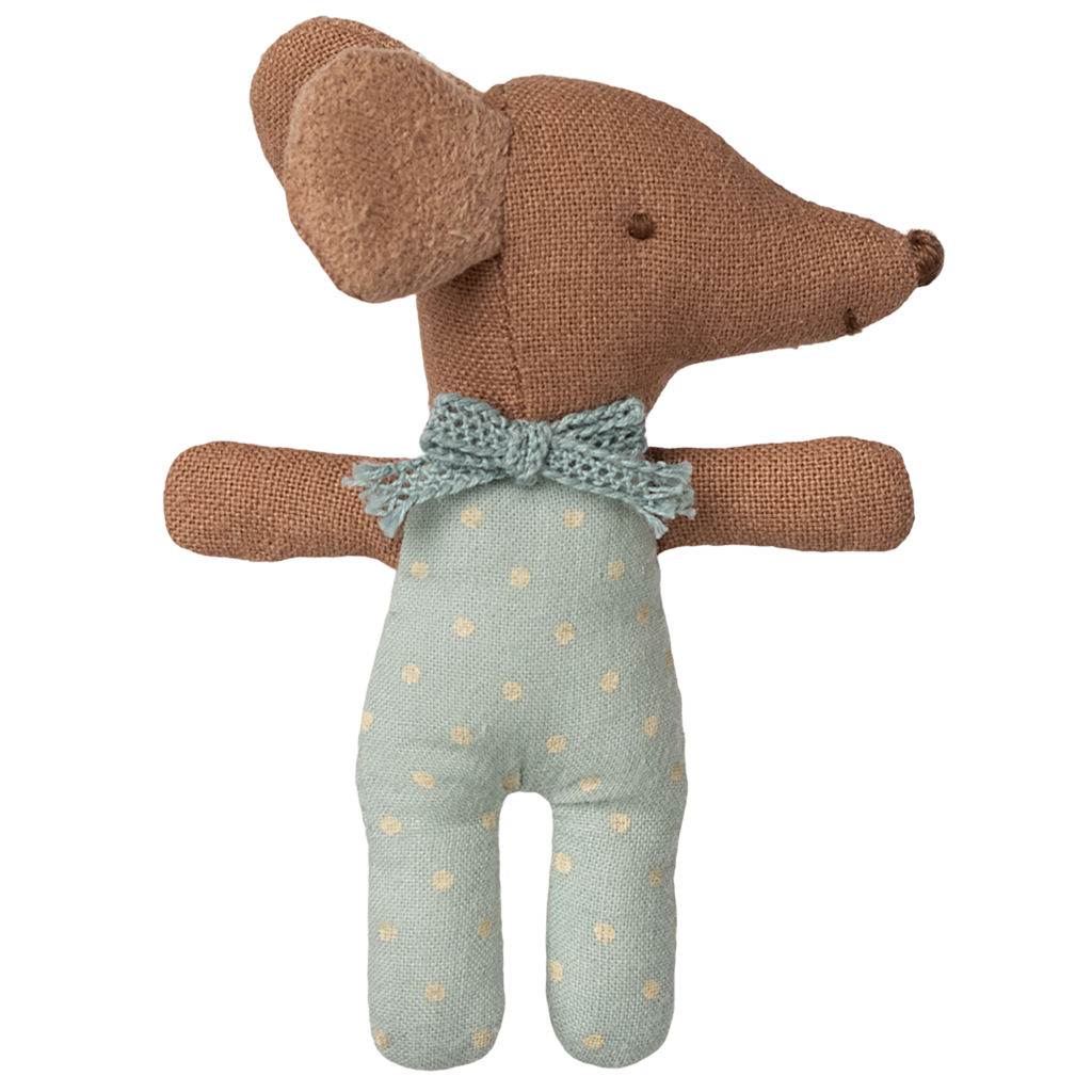 A soft, brown toy dog with floppy ears and a textured surface, wearing a blue polka dot outfit and bow tie, set against a white background.