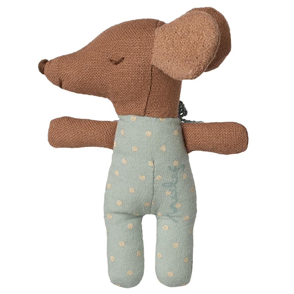 A soft, brown toy dog with floppy ears and a textured surface, wearing a blue polka dot outfit and bow tie, set against a white background.
