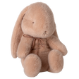 Maileg small bunny plush in powder pink with a rose gold bow and floppy ears on a white background.