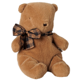 Maileg small teddy bear plush toy in mushroom brown with a plaid bow tie, sitting profile view.