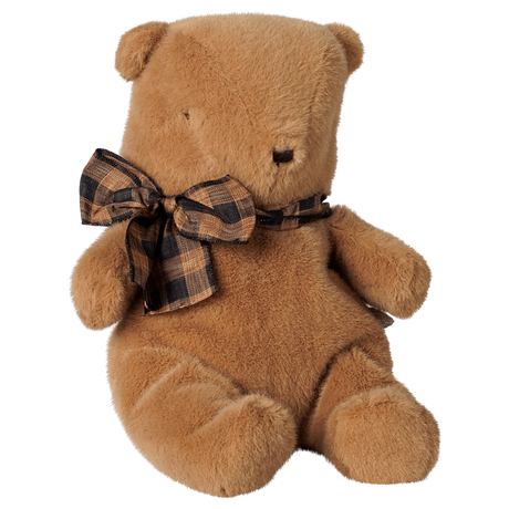Maileg small teddy bear plush toy in mushroom brown with a plaid bow tie, sitting profile view.