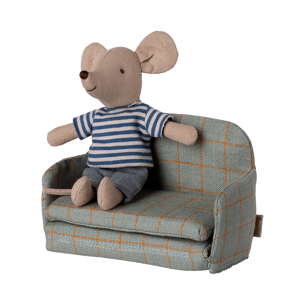 A miniature gray fabric sofa with a grid pattern of orange lines. The armrests and back are rounded, giving a cozy, inviting appearance.