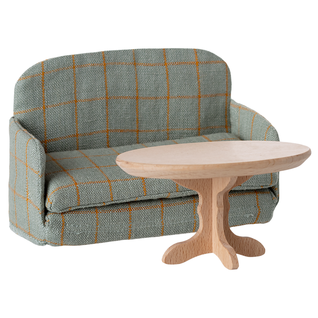 A miniature gray fabric sofa with a grid pattern of orange lines. The armrests and back are rounded, giving a cozy, inviting appearance.
