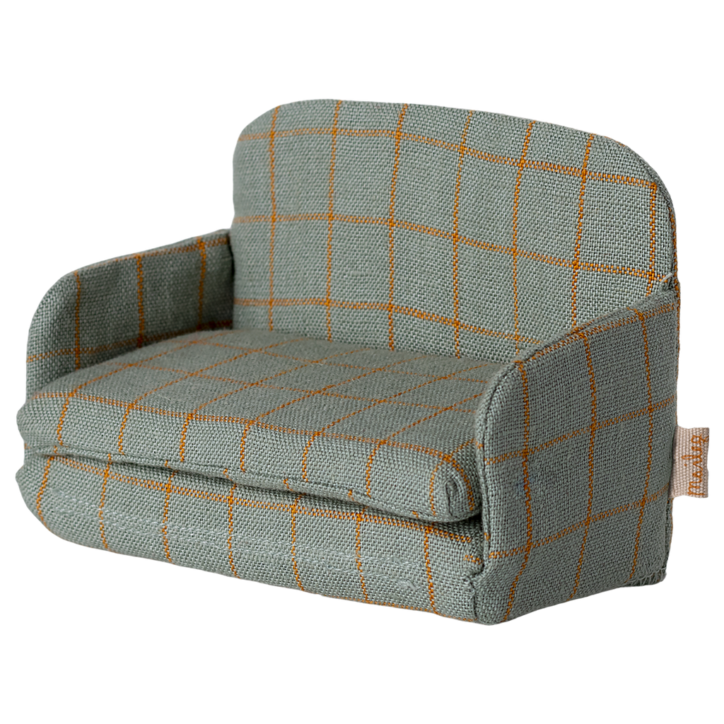 A miniature gray fabric sofa with a grid pattern of orange lines. The armrests and back are rounded, giving a cozy, inviting appearance.