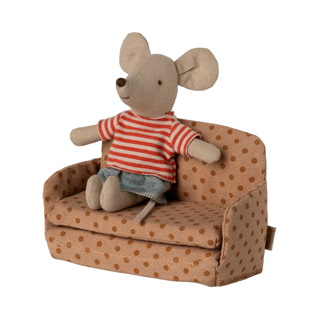 Miniature beige sofa with brown polka dots, featuring plush cushions and compact armrests. The playful design suggests a cozy, dollhouse ambiance.