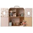 Dollhouse shaped like a suitcase, featuring mouse figurines. It has a cozy bedroom, a living area, and a kitchen, evoking a playful and quaint charm.