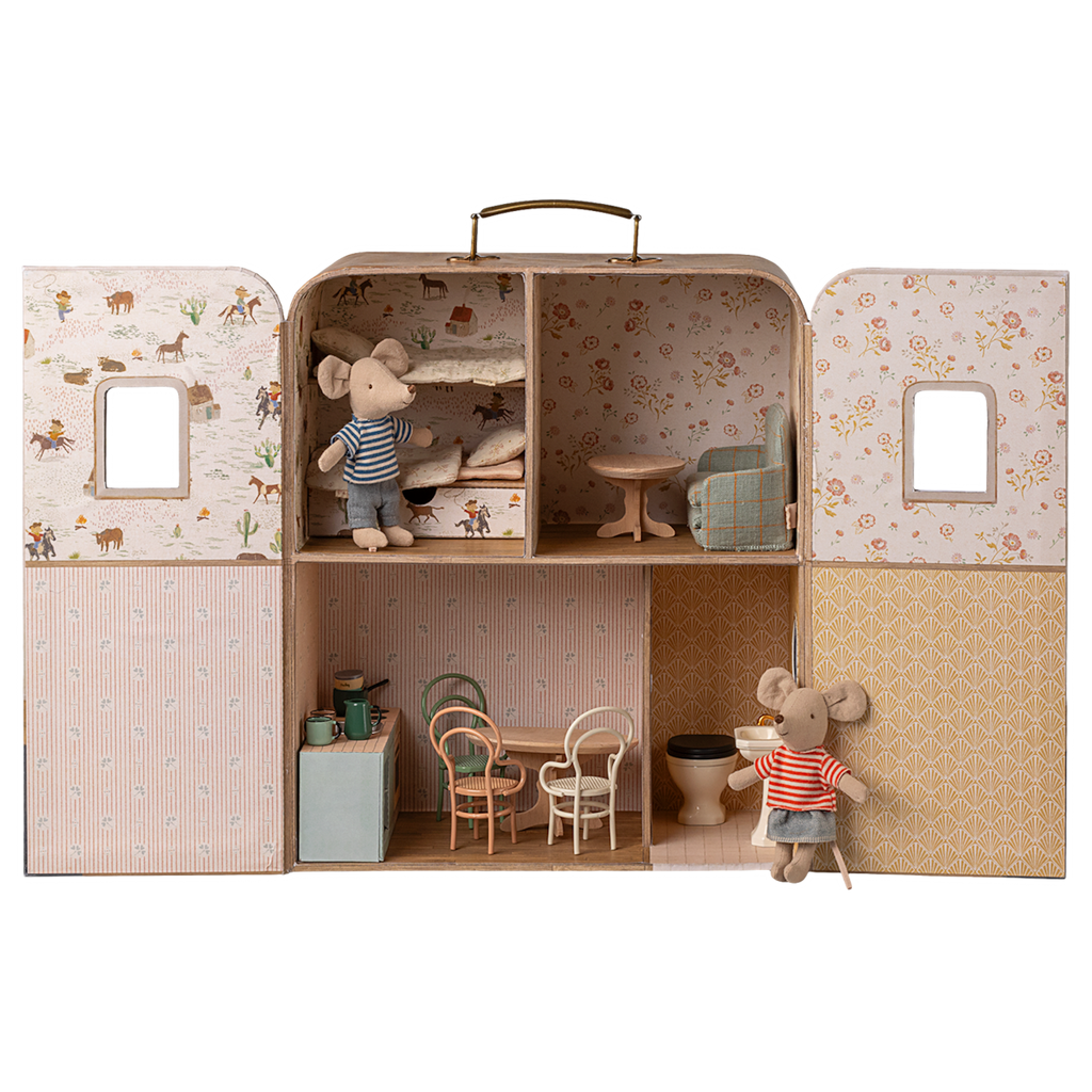Dollhouse shaped like a suitcase, featuring mouse figurines. It has a cozy bedroom, a living area, and a kitchen, evoking a playful and quaint charm.