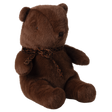 A soft, brown teddy bear with a leopard print scarf sits upright against a white background. The bear exudes a cozy and comforting vibe.