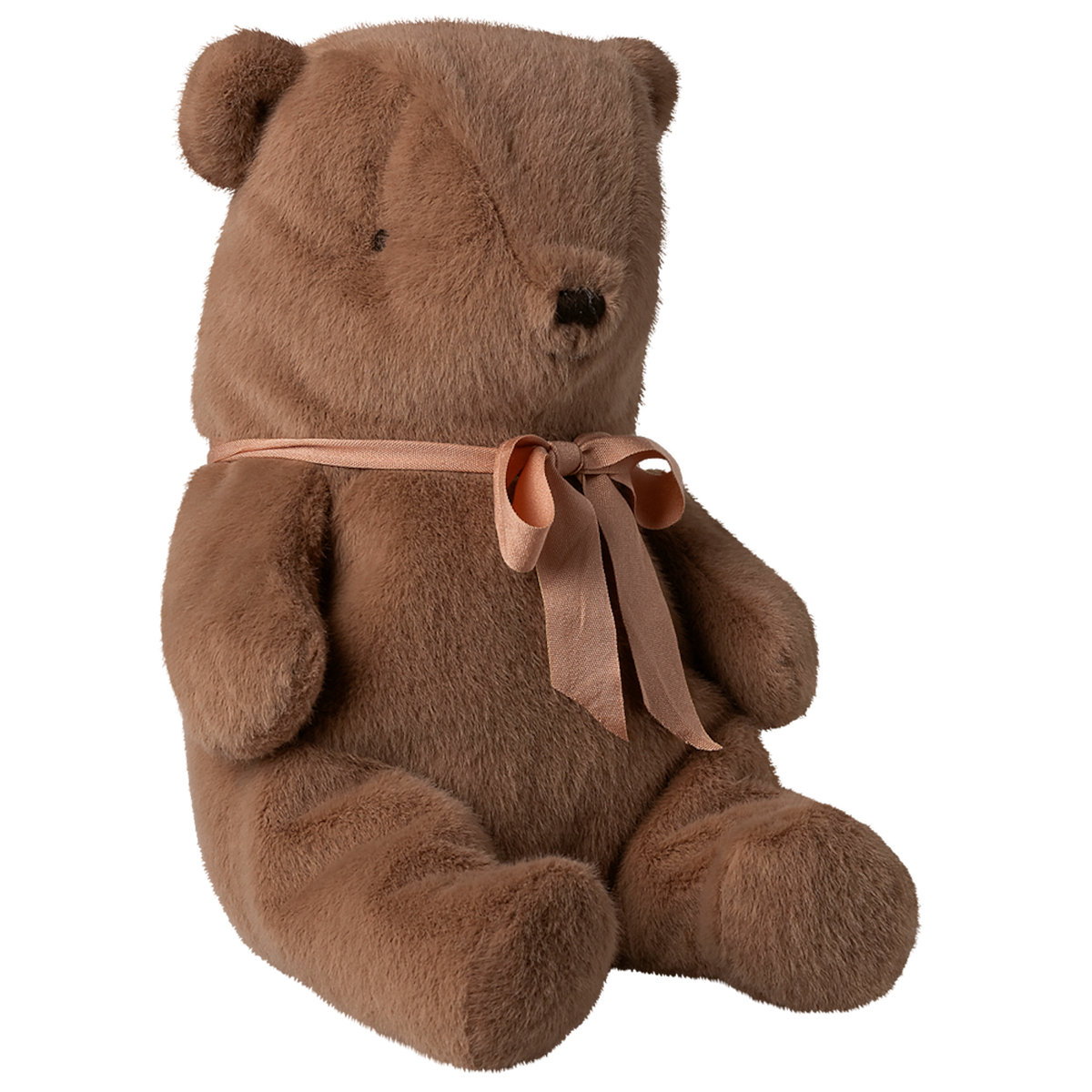 A soft brown teddy bear sits against a white background, adorned with a peach ribbon tied in a bow around its neck, conveying a cozy and cuddly vibe.