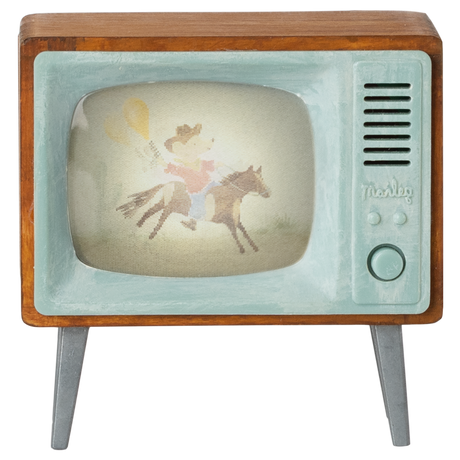 Vintage toy TV with wooden frame and teal accents displays an illustration of a cowboy mouse riding a horse, conveying nostalgia and whimsy.
