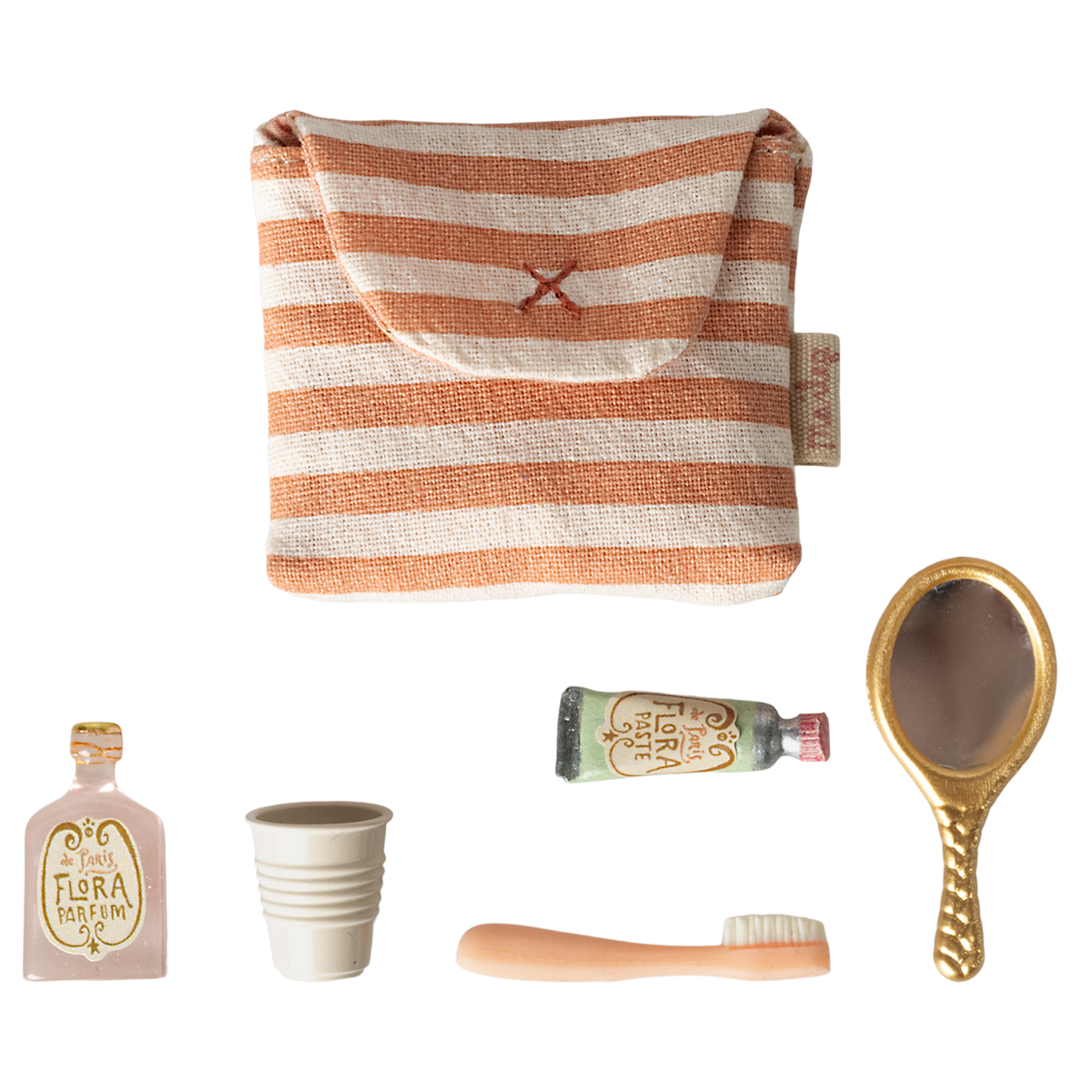 A small striped pouch and miniature items: two perfume bottles, a collapsible cup, a toothbrush, and a vintage-style hand mirror, arranged on a white background.