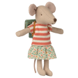 Plush mouse toy wearing a red-striped top and floral skirt, with a teal backpack. The toy's neutral expression conveys a whimsical charm.