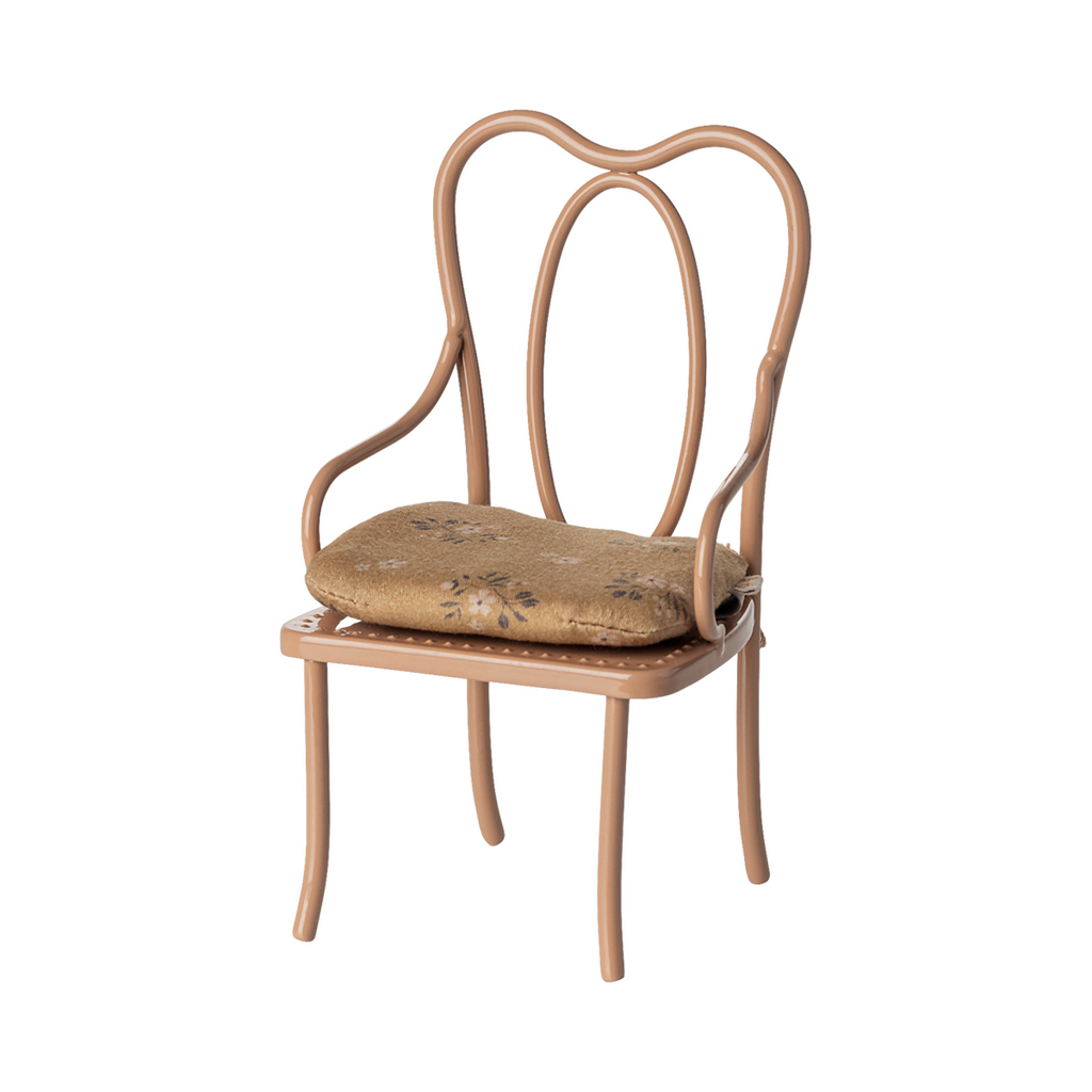 Elegant miniature antique chair with a beige floral-patterned cushion. The chair has curved metal legs and intricate, looping back design, conveying vintage charm.