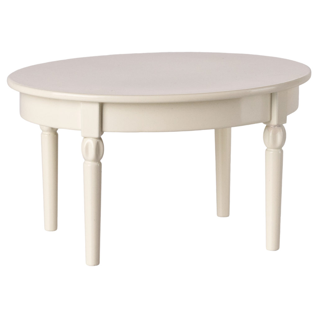 A miniature round, off-white wooden table with turned legs. The design is simple and elegant, conveying a classic and cozy feel.