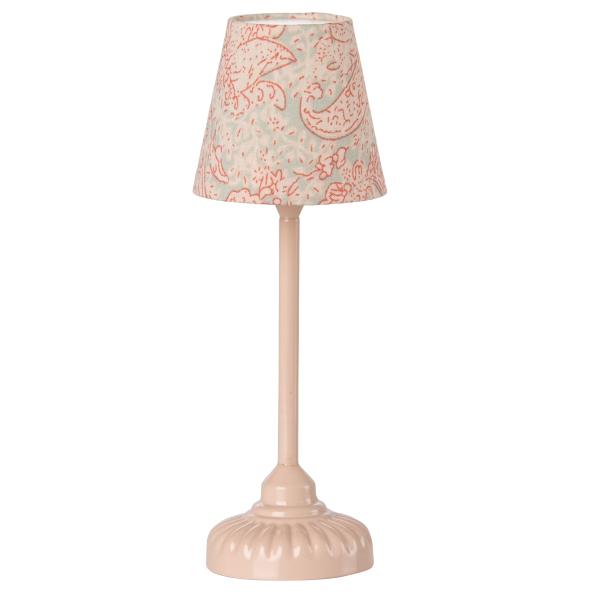 A vintage-style table lamp with a soft pink base and stem. The lampshade features a light blue fabric with intricate red floral patterns, set against a white background.