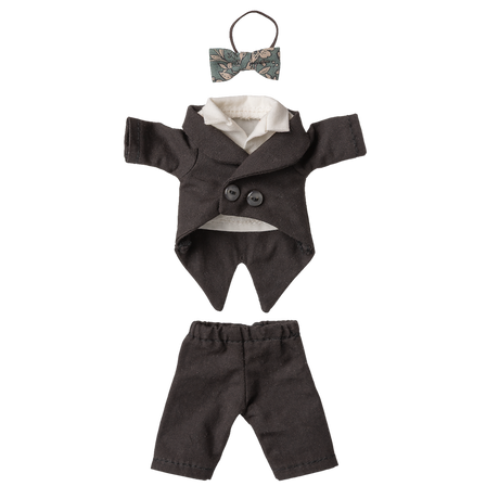 Black doll tuxedo set against a white background, featuring a small bow tie, a double-breasted jacket with white lining, and matching pants.