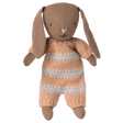 Brown Maileg micro bunny plush toy wearing a dusty rose and light blue striped knitted suit on a white  background.