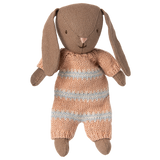 Brown Maileg micro bunny plush toy wearing a dusty rose and light blue striped knitted suit on a white  background.