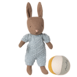 Brown Maileg micro rabbit plush wearing a light blue knitted romper standing next to a striped fabric toy ball.
