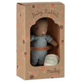 Maileg Baby Rabbit in blue knit suit and floral box. Small brown plush bunny toy with magnets in hands.