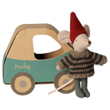 Maileg Christmas mouse little brother in a striped sweater standing next to a cardboard toy car box.