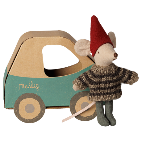 Maileg Christmas mouse little brother in a striped sweater standing next to a cardboard toy car box.