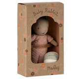 Maileg Baby Rabbit in a rose knitted suit, packaged in a floral box with a ball. 