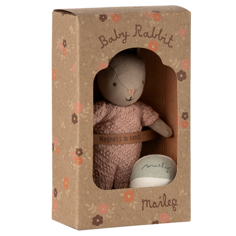 Maileg Baby Rabbit in a rose knitted suit, packaged in a floral box with a ball. 