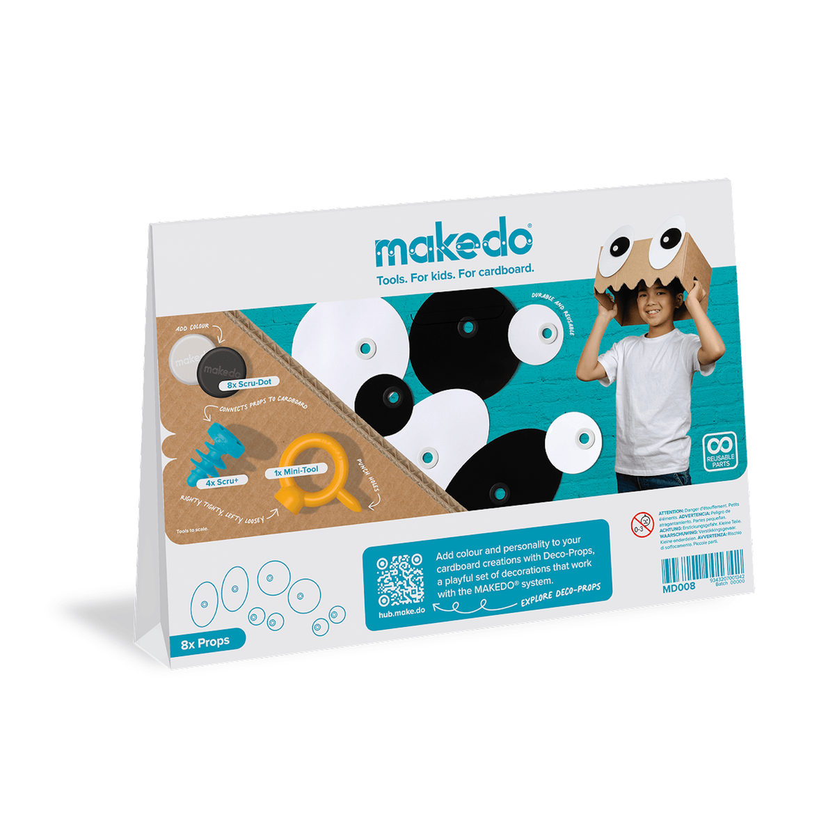 Back packaging for a Makedo craft kit showing eye props, tools, and a child wearing a cardboard box mask.
