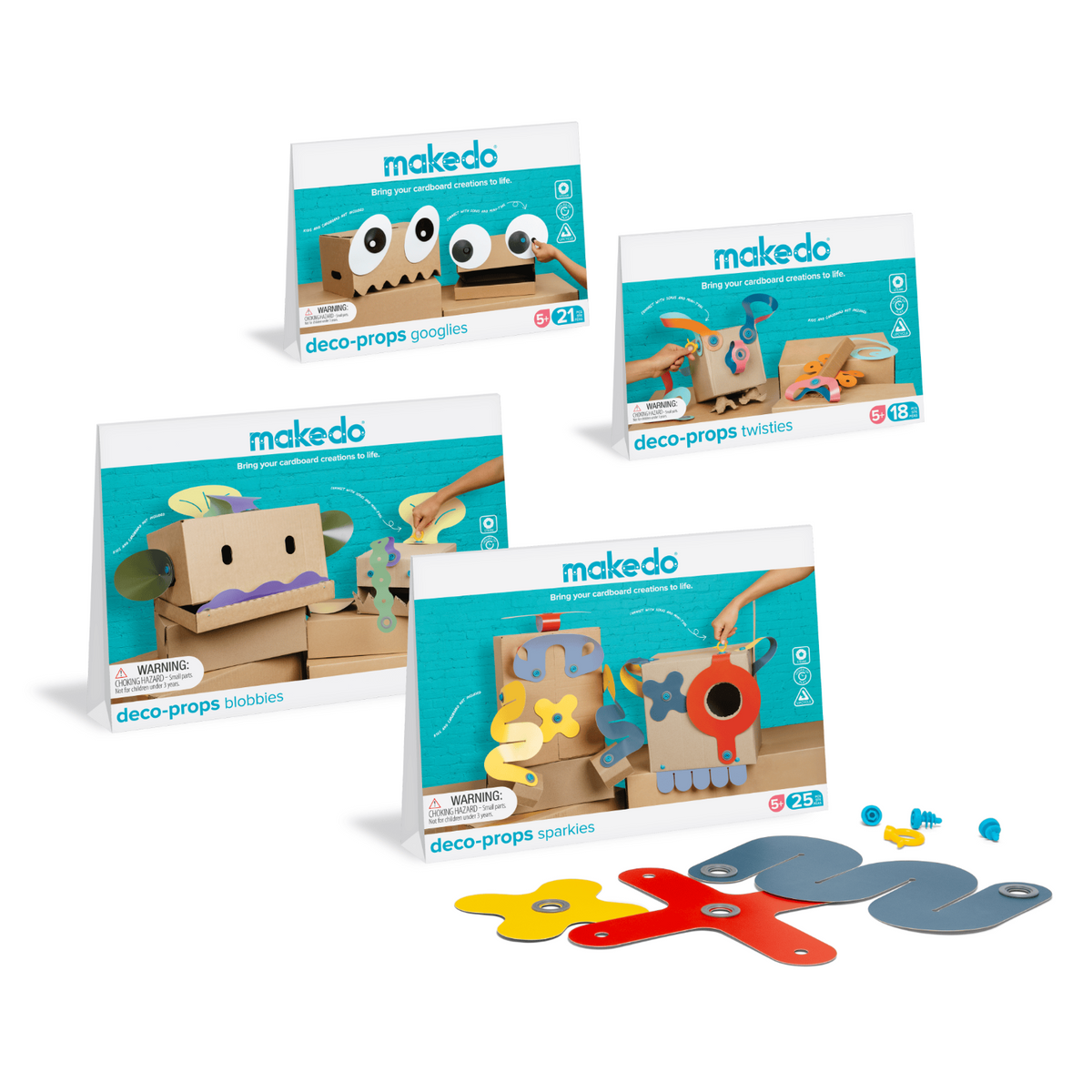 Four Makedo deco-props cardboard crafting kits displayed together, including googlies, twisties, blobbies, and sparkies.
