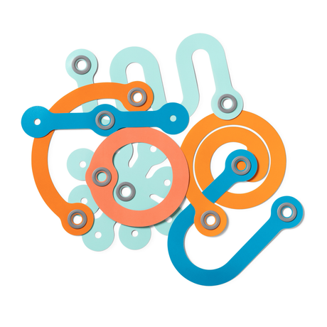Abstract arrangement of colorful, curved toy connecting pieces in orange, light blue, dark blue, and peach.