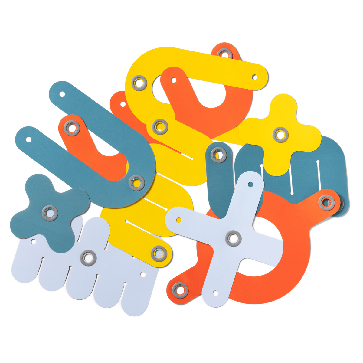 Colorful geometric cardboard shapes with eyelet holes layered against a white background.