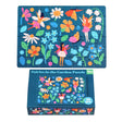 Colorful fairy-themed puzzle with 48 pieces, featuring vibrant flowers and whimsical fairies on a dark blue background, neatly packed in a matchbox-sized box.
