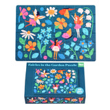 Colorful fairy-themed puzzle with 48 pieces, featuring vibrant flowers and whimsical fairies on a dark blue background, neatly packed in a matchbox-sized box.