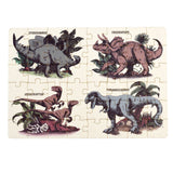 Colorful dinosaur puzzle featuring Stegosaurus, Triceratops, Velociraptor, and Tyrannosaurus, packed in a matchbox-sized box.